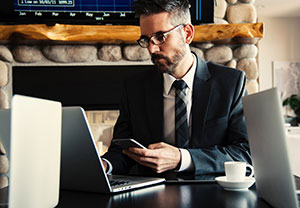 Business man checking his website for customer referrals