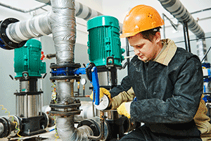 Man fixing a Together Energy heating pump