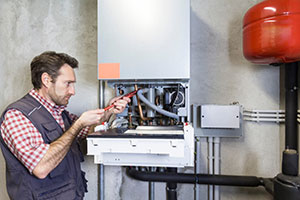Plumber fixing gas central boilers