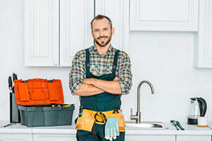 Plumber smiling about the plumbing bursary being back