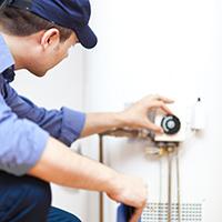 A man fixing bolier breakdowns