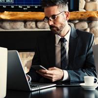 Business man checking his website for customer referrals