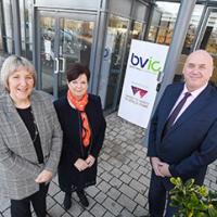 Staff stood outside new premises heating and ventilation insulation business