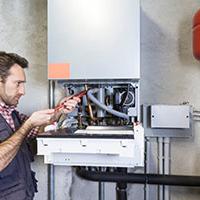 Plumber fixing gas central boilers