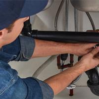 Plumber under sink - Plumber Earnings Heat Up In July